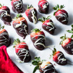 Chocolate-Dipped Strawberries on sheet pan vertical