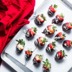 Chocolate-Dipped Strawberries on sheet pan overhead