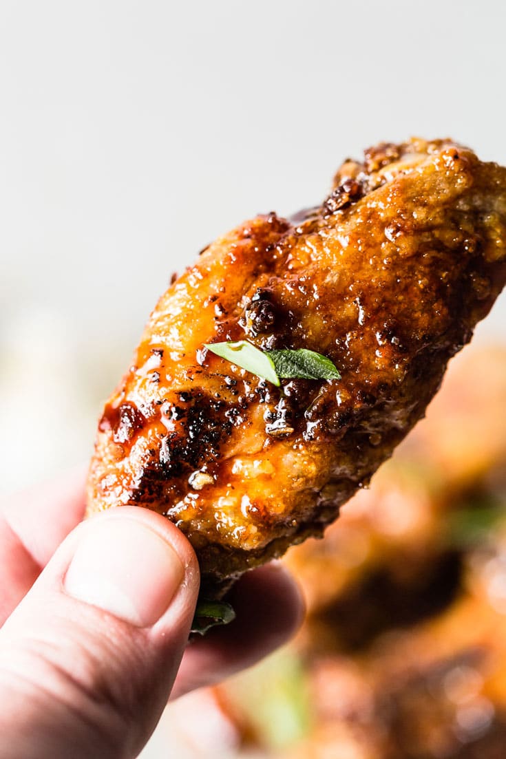 Honey-Garlic Air Fried Chicken Wings in hand