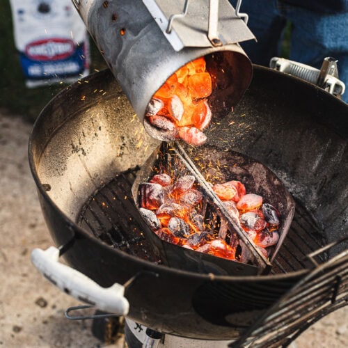 Kingsford Charcoal briquets into the grill