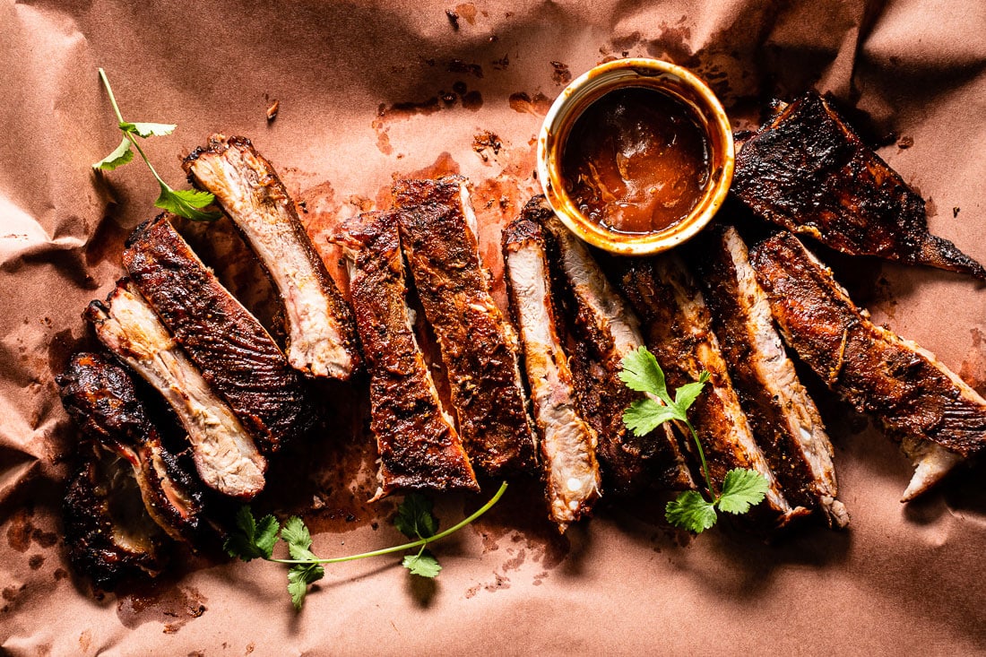 Smoked Sous Vide Ribs on butcher paper with bbq sauce