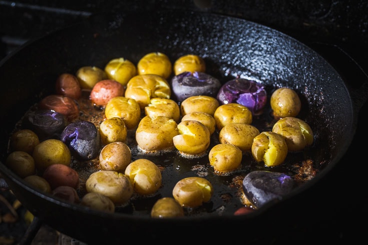 baby potatoes cooking in skillet