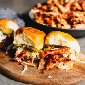bbq chicken sliders with slaw on cutting board horizontal