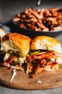 bbq chicken sliders with slaw on cutting board