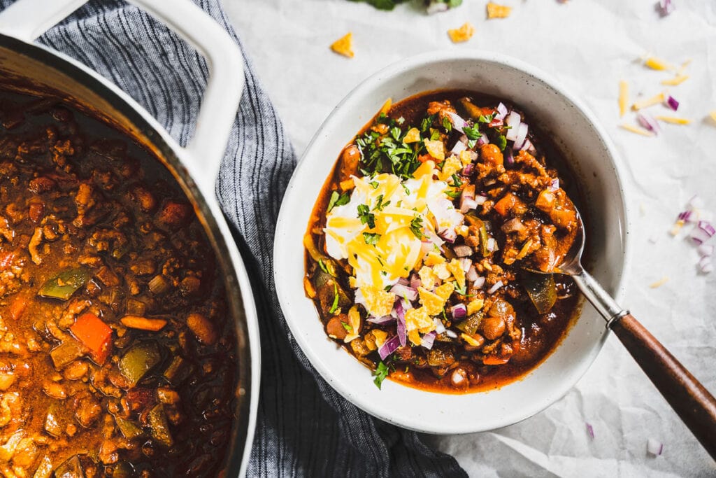 beef chili in a bowl with toppings horizontal 1