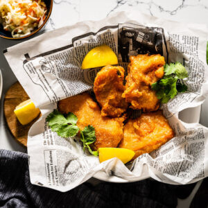 beer battered deep fried salmon on parchment horizontal