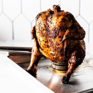 beer can chicken resting on sheet pan