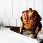 beer can chicken resting on sheet pan horizontal
