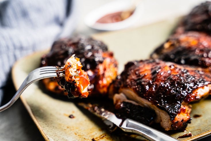 bite of BBQ Chicken Thighs close up