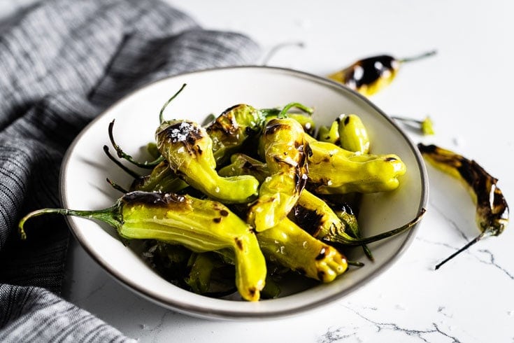 blistered shishito peppers in bowl horizontal 1