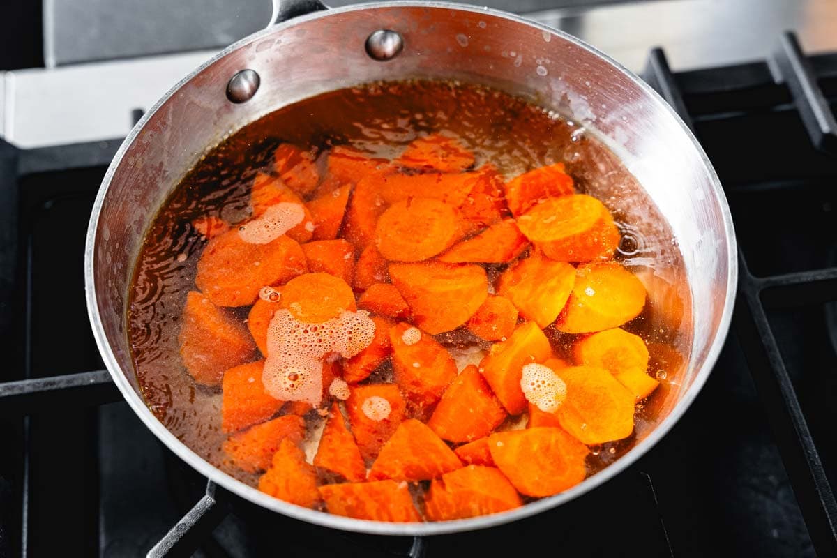 boiling carrots in a pot