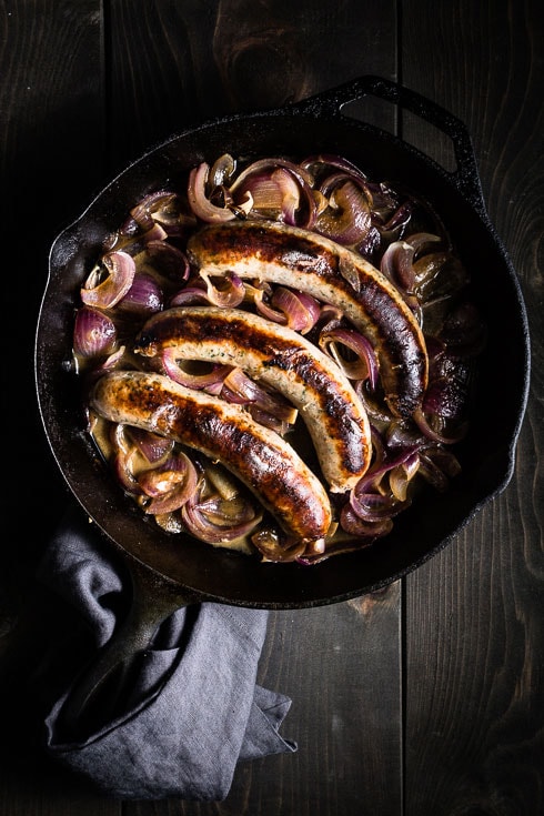 bratwurst sausage and onions skillet vertical