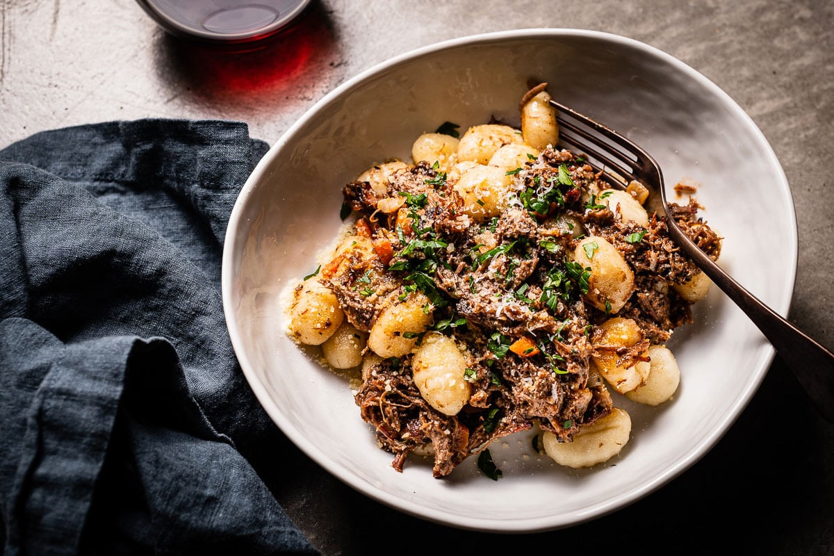 brisket ragu with gnocchi in bowl overhead