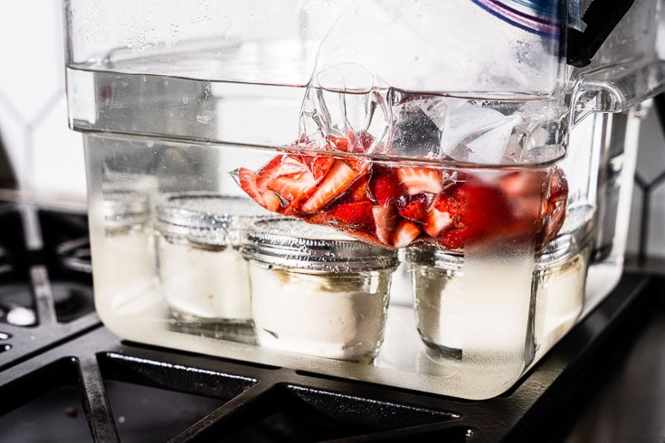 cheesecake and strawberries in sous vide water bath