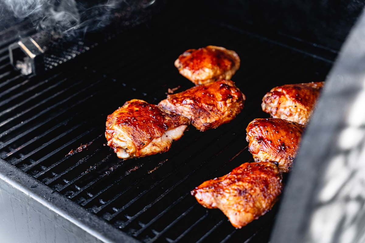 chicken thighs smoking in pellet smoker