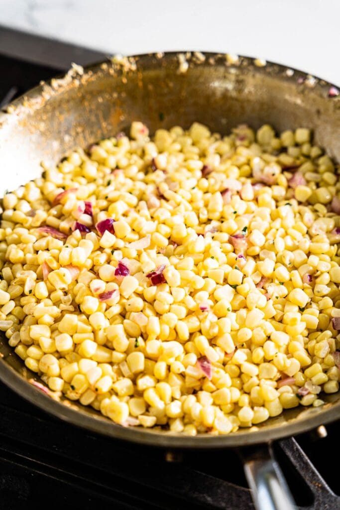 corn cooking in a skillet