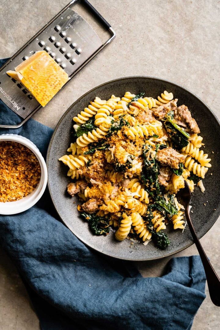 creamy sausage and kale pasta overhead vertical