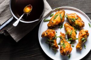 crispy air fryer chicken wings with honey-sriracha sauce