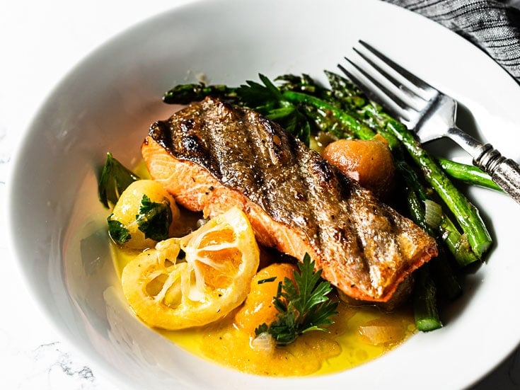 Grilled Salmon Recipe with Crispy Skin and a Burst Cherry Tomato