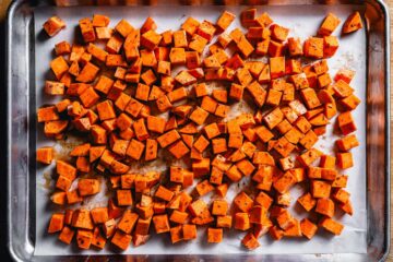 cubed sweet potatoes on a sheet pan