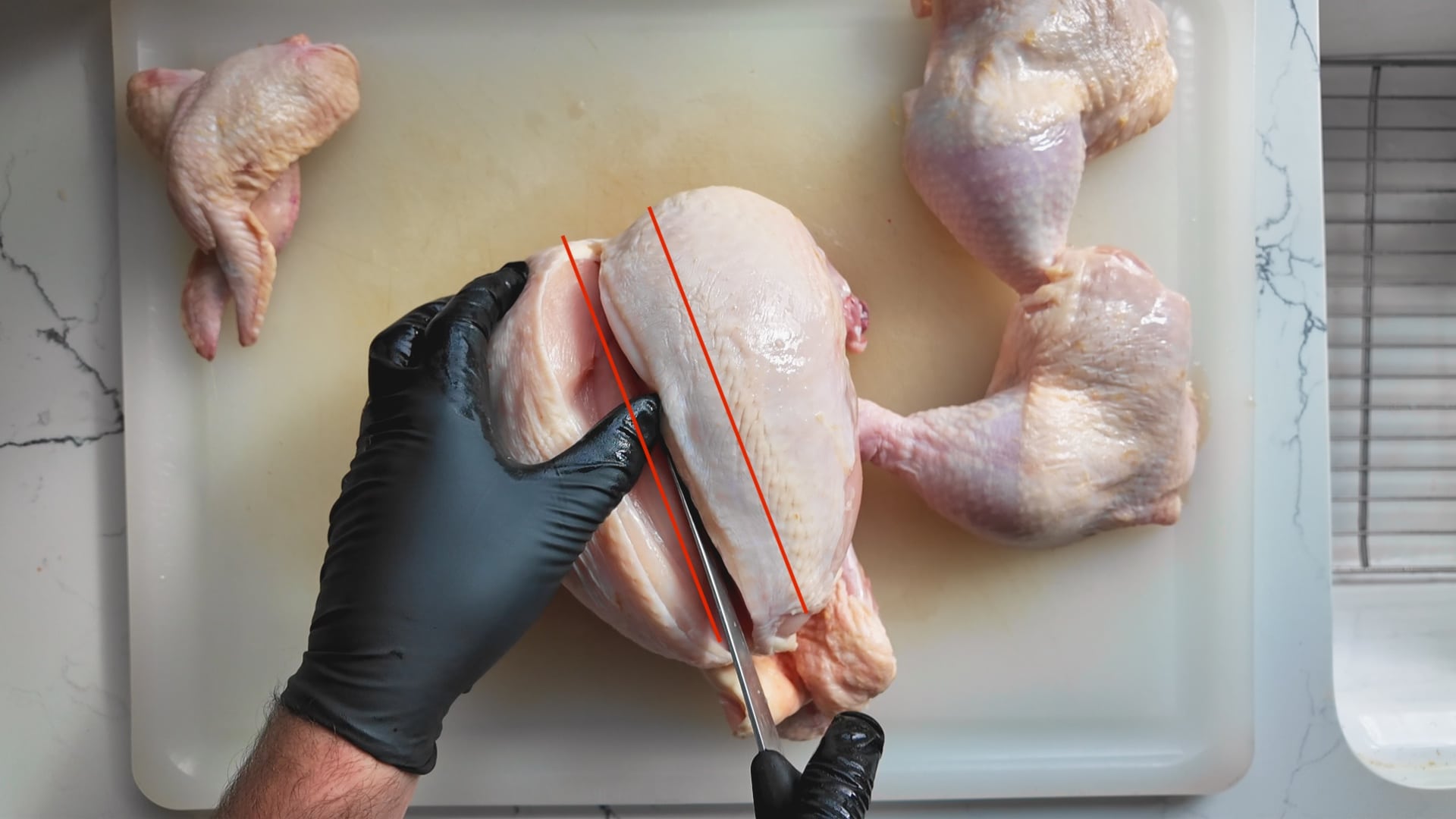 cutting the breasts off a whole chicken