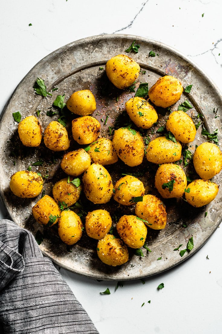 duck fat potatoes on metal plate overhead