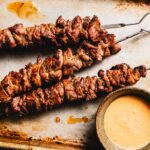 grilled lamb skewers on a sheet pan horizontal