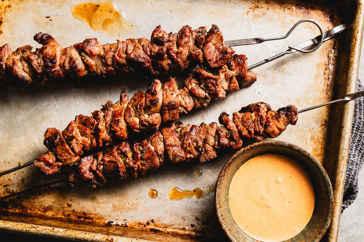 grilled lamb skewers on a sheet pan horizontal
