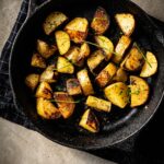 grilled potatoes in skillet vertical