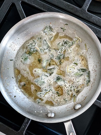 herb butter browning in skillet for turkey