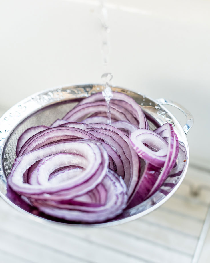 hot water over red onions
