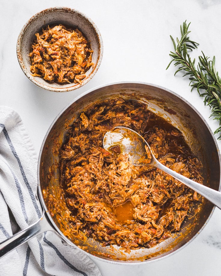 There are few dishes as comforting as pork shoulder ragu over creamy polenta on a chilly winter day. The high pressure takes all the pressure off of you. The pork is fall-apart tender after 35 minutes under high pressure. As easy and hands-off as braises can be, the time involved to make the meat tender be a deterrent to making them. That's where an Instant POt or pressure cooker makes. This pork ragu is ready in about an hour. Pretty amazing, right? Serve it with pasta or polenta. or whatever else? even in tacos, over gnocchi, risotto or rice Recipe variations: You could use bbq sauce instead of the tomatoes for bbq pulled pork. You can also switch up the protein and use beef or lamb to make ragu from those. They will all taste great and it's pretty impossible to mess up. How to make pork ragu in a pressure cooker If you are anything like me and get intimidated by long recipes, let me give it to you in the most basic way. This recipe looks a little long, but don't let that intimidate you. Here are the basic steps so you can even make it without a recipe. Don't have an Instant Pot or a Pressure Cooker? Well, obviously you should order one right now. But if you want to make it before it arrives, then you are in luck. You can follow the same steps and use a dutch oven instead. It will take about ___ hours instead of 35 minutes. Special Equipment Used Instant Pot or a Pressure CookerLadleCutting boardkitchen twine