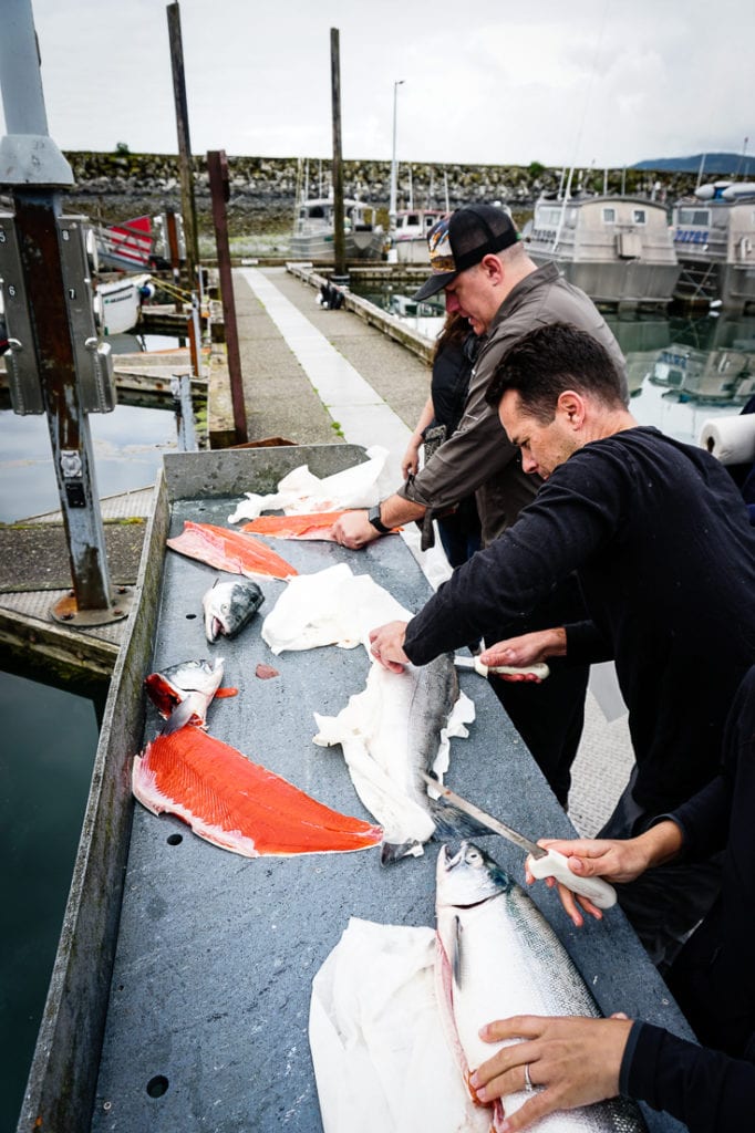 justin mcchesney cleaning a copper river salmon