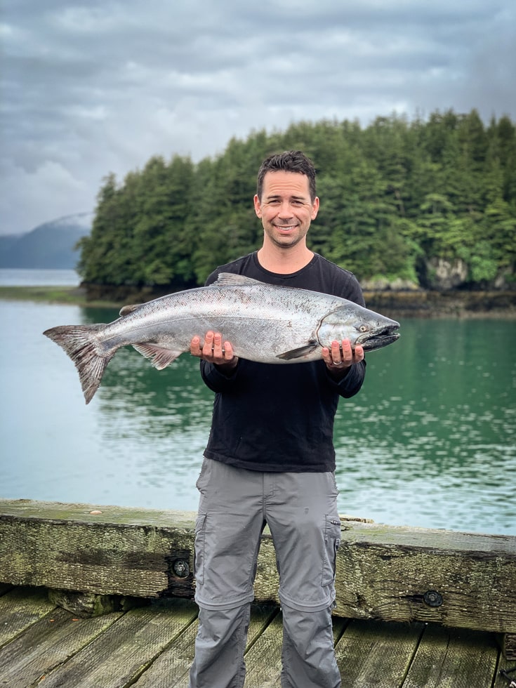 justin mcchesney holding a copper river king salmon
