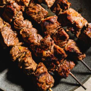 lamb kabobs on a plate side view