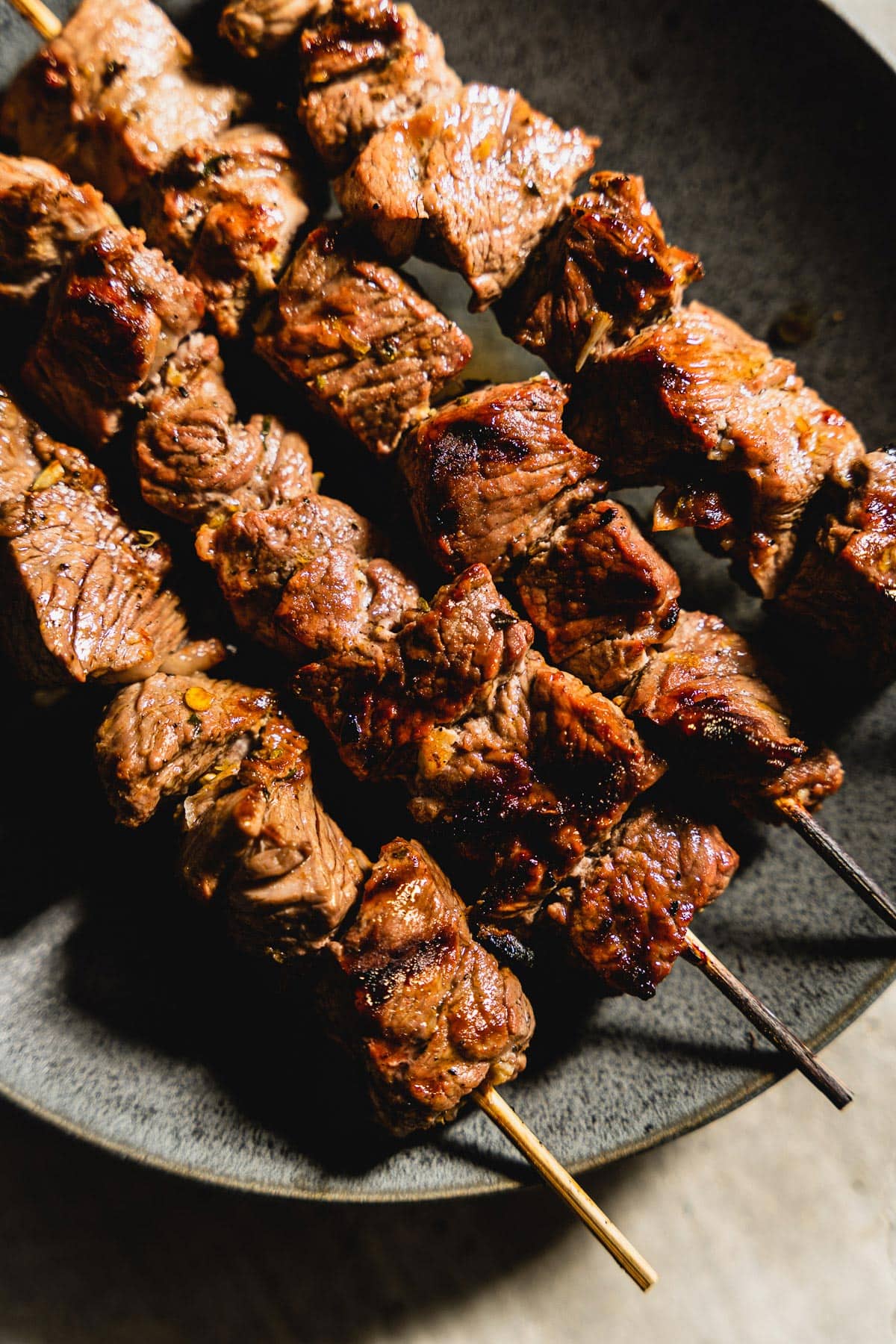 lamb kabobs on a plate side view