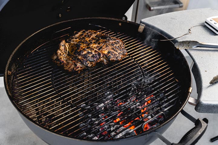 The two-zone grilling method for leg of lamb.