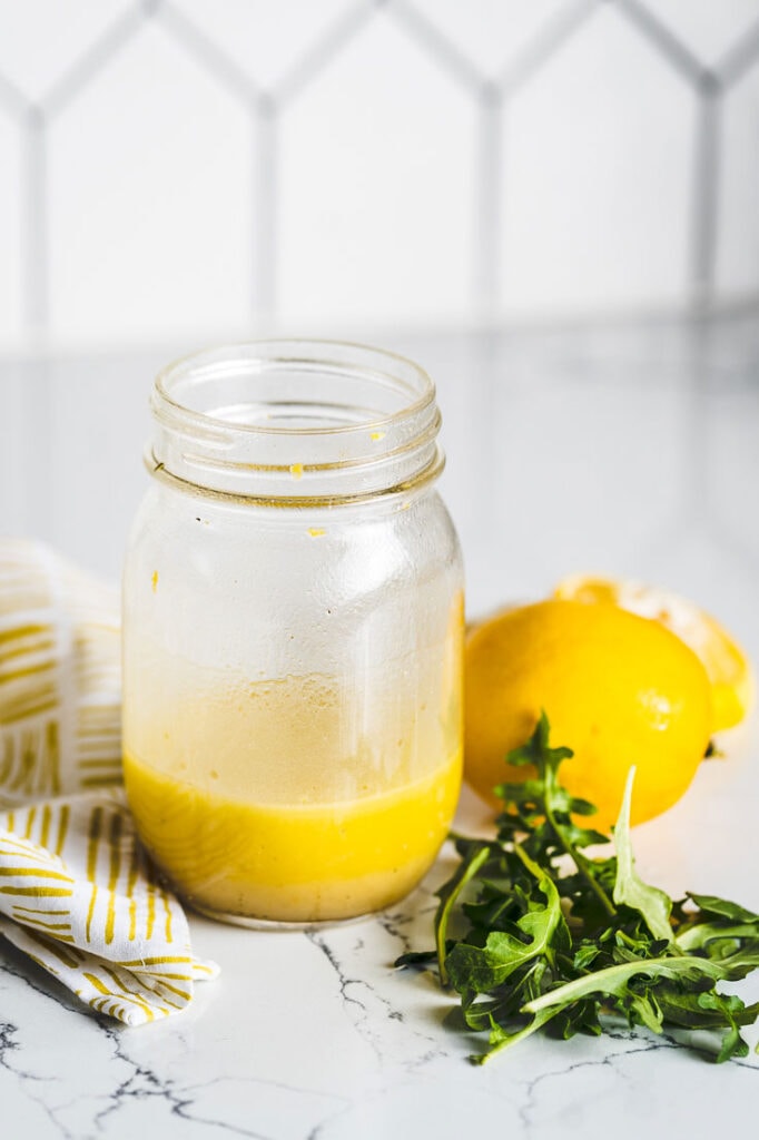 lemon vinaigrette in mason jar vertical
