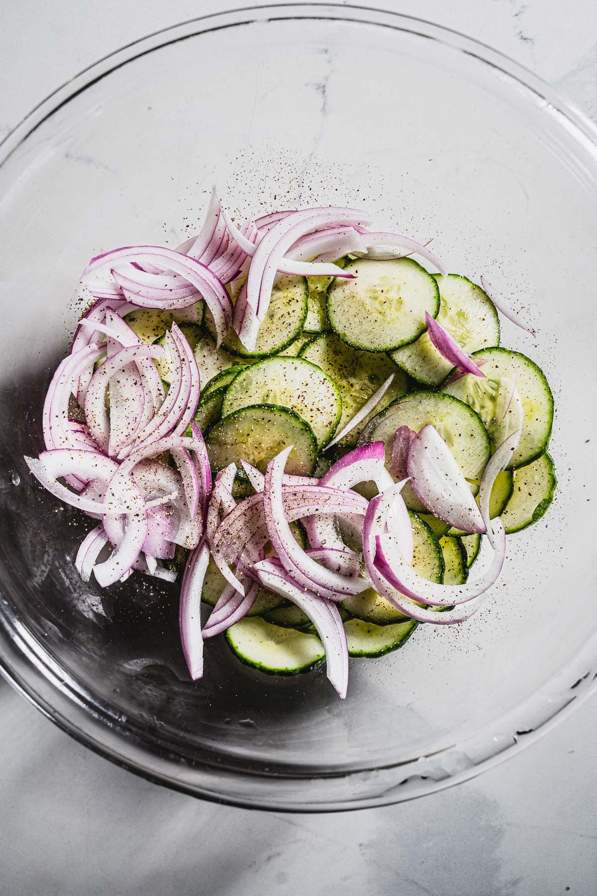 mixing a simple simple cucumber salad