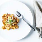 Pasta Bolognese Overhead with fork and napkin