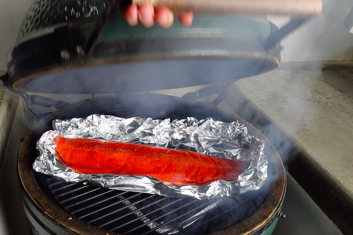 placing salmon in the big green egg smoker