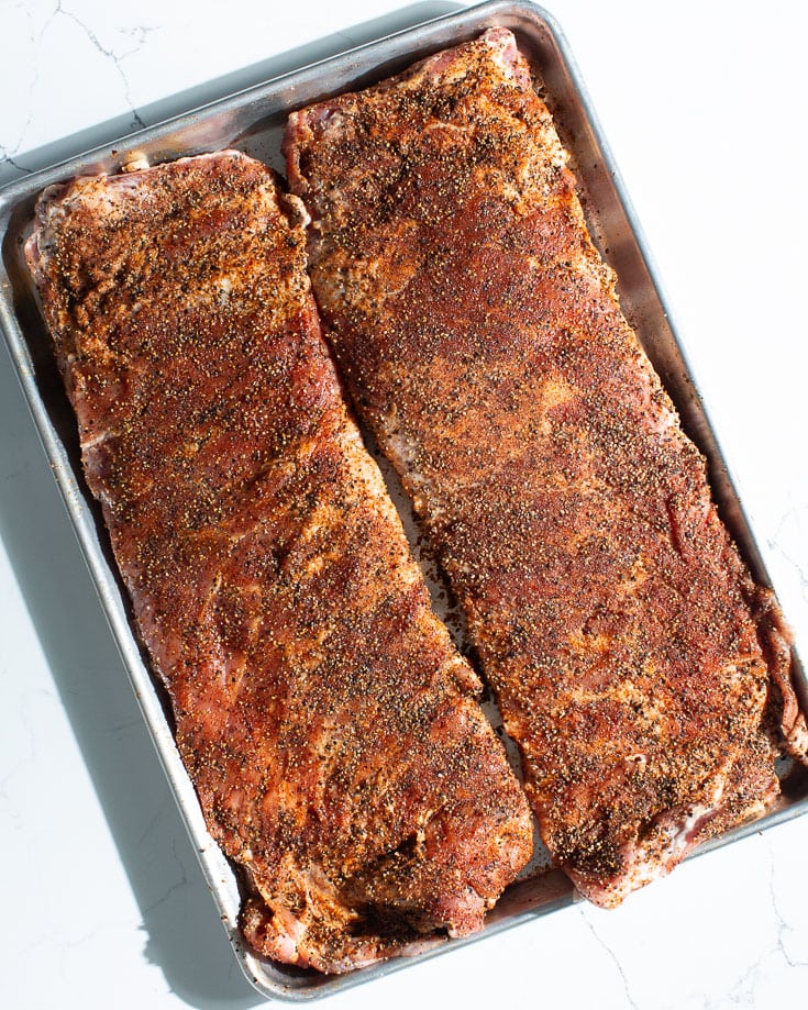 pork spare ribs with rub on sheet pan