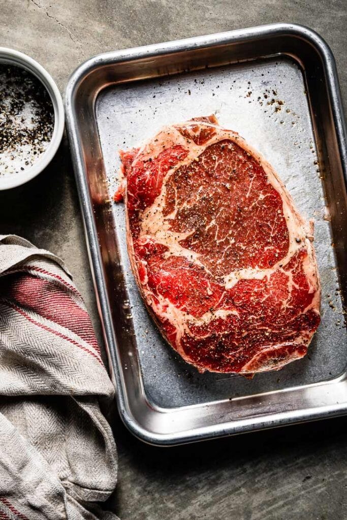 prime rib eye steak on sheet pan