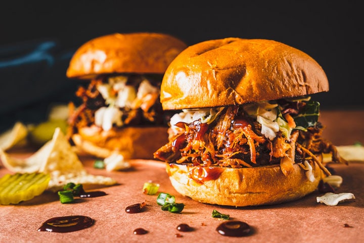 pulled pork sandwich with bbq sauce on butcher paper