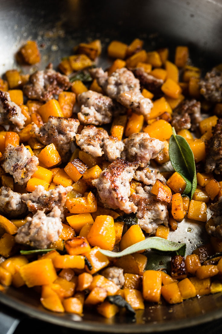 roasted butternut squash and sausage in skillet