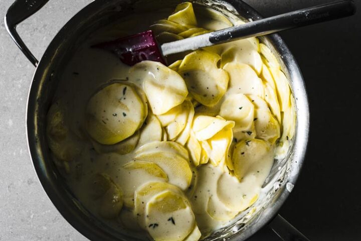 scalloped potatoes with sauce in pot