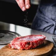 seasoning a new york strip steak with salt