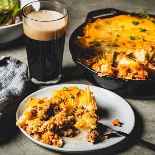 shepherds pie on plate and skillet with a beer 2