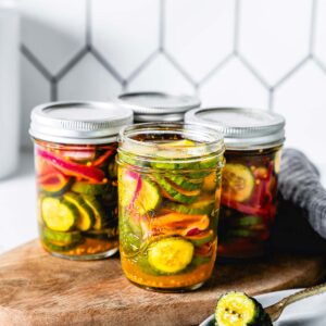 side view of bread and butter pickles in jars vertical