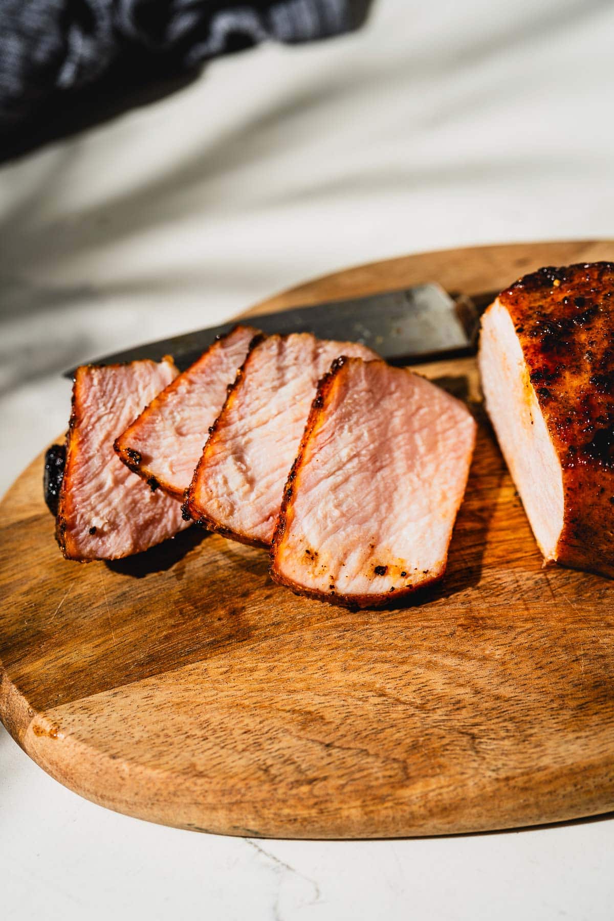 sliced smoked pork chops on cutting board
